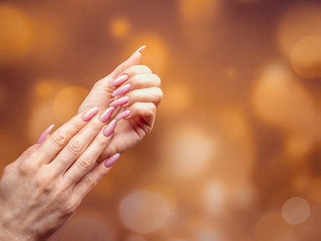 Beautiful Woman Hands. Spa and Manicure concept. Female hands with pink manicure.の写真素材