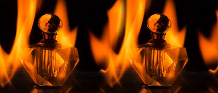 Perfume bottle in the middle of the fire. Product photography with effect.