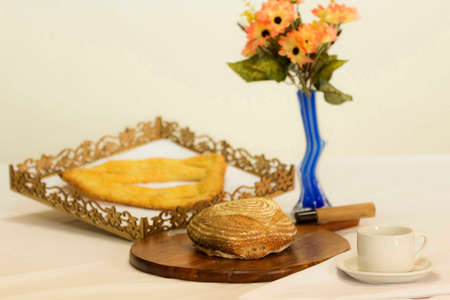 Bread is a staple food prepared from a dough of flour (usually wheat) and water, usually by baking.の写真素材