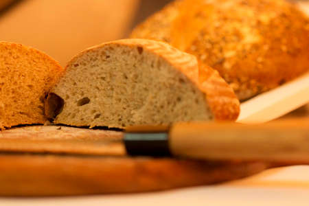 Bread is a staple food prepared from a dough of flour (usually wheat) and water, usually by baking.の写真素材
