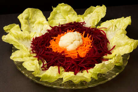 Plate of beetroot, lettuce, carrot and cauliflower salad. Food photography to promote nutritional cooking.の写真素材