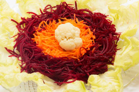 Plate of beetroot, lettuce, carrot and cauliflower salad. Food photography to promote nutritional cooking.の写真素材