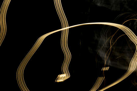 Light painting, light painting, light drawing, or light art performance photography are terms that describe photographic techniques of moving a light source while taking a long exposure photograph, either to illuminate a subject or space, or to illuminate the camera to 'draw', or moving the camera itself while exposing light sources.の写真素材