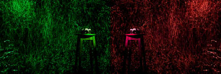 Photo camera on a wooden bench in a photo studio in the background with a trail of colored light.の写真素材