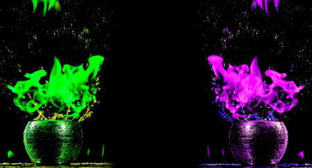 Water mixed with lighter fluid inside a golden pot throwing ice stone to cause thermal shock and cause a splash of liquid with fire on the black background.の写真素材