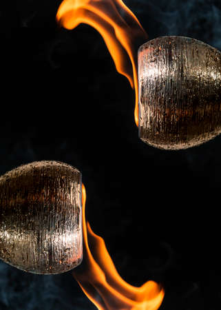 Water mixed with lighter fluid inside a golden pot throwing ice stone to cause thermal shock and...