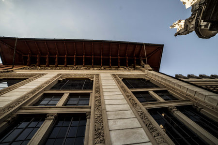 Old building seen from the bottom up a roof and the sky in the background.の写真素材