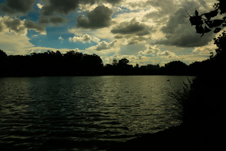Sunset on the lake of Parque do Ibirapuera, SÃ£o Paulo, Brazil. Photograph taken on the shores of the lake in one of the largest parks in the city of SÃ£o Paulo.の写真素材