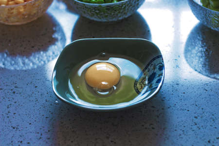 raw egg on bowlの写真素材
