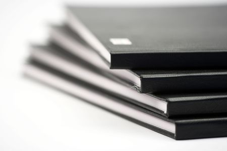 Stack of black notebooks close upの写真素材