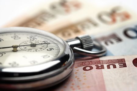 Chronometer and euro bills close up