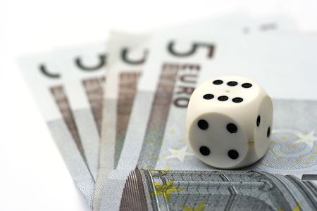 Dices over euro bills close upの写真素材
