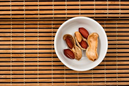 Peanuts close up in white bowlの写真素材