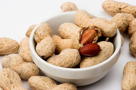 Peanuts close up in white bowl