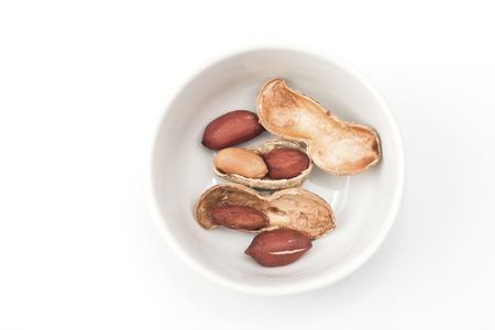 Peanuts close up in white bowl