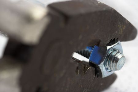 Pliers and nut close upの写真素材