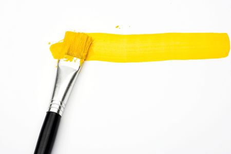 Yellow line and brush over whiteの写真素材