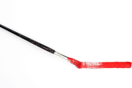 Red line and brush over whiteの写真素材