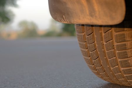 A car tire close up at sunsetの写真素材
