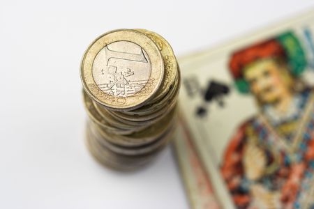 stack of coins and playing cardの写真素材