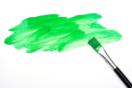 Green spot and brush over whiteの写真素材