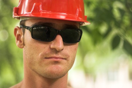 young worker with red helmetの写真素材
