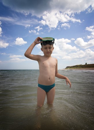 boy with scuba mask in the seaの写真素材