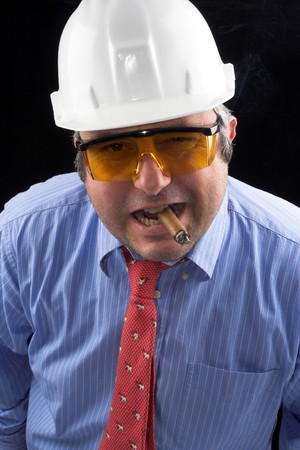 man with goggles and helmet smoking cigar