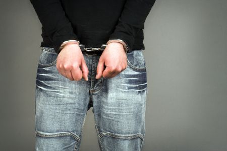 Handcuffs  on the man's  hands
