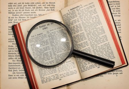 old books and magnifying glass close upの写真素材