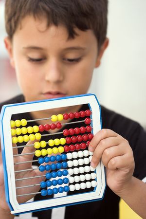 Schoolboy calculate with abacus ,shallow dofの写真素材