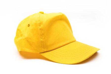 Yellow baseball cap over whiteの写真素材
