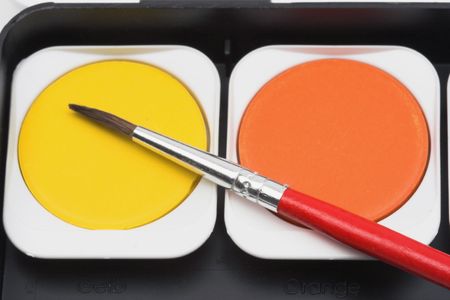 watercolor paint and brush close upの写真素材