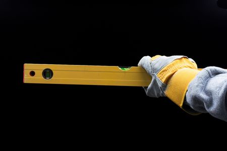  man holding a level over black
の写真素材