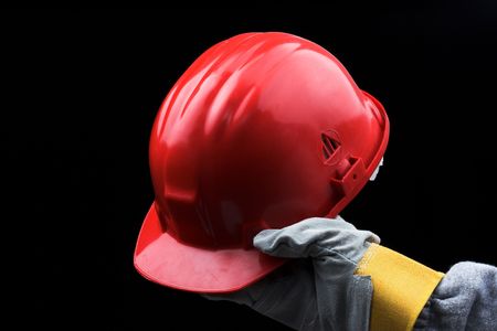 man holding red helmet over blackの写真素材