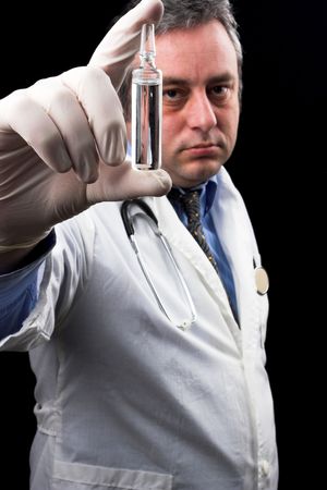 medic holding ampule with vaccineの写真素材