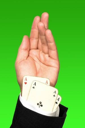 Close up of cheating poker player's hand.Vintage cards