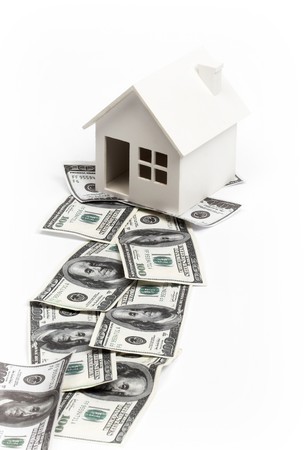 Model of house on the path of money. Real estate concept の写真素材
