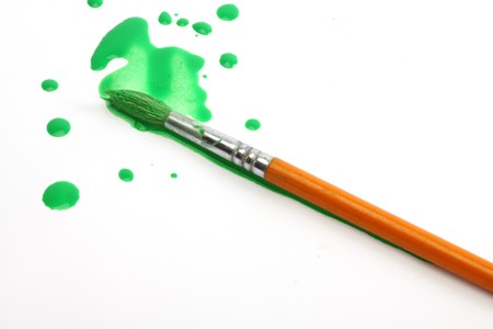 splashes of green paint and brush の写真素材