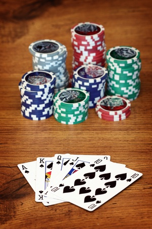 Playing poker concept. Stack of chips and playing cards
