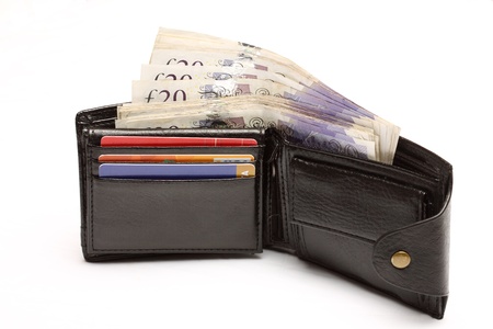 Open leather wallet with cash over white