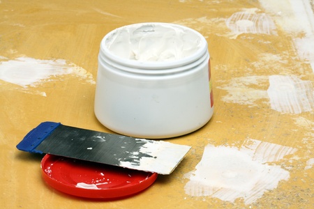 Putty knife with  paste close upの写真素材