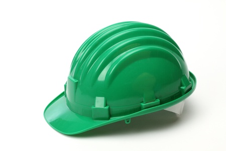 Green helmet over white background の写真素材