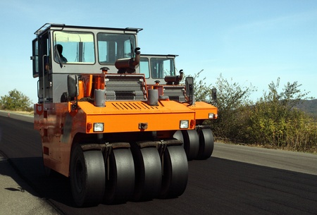 Road roller in work on the roadの写真素材