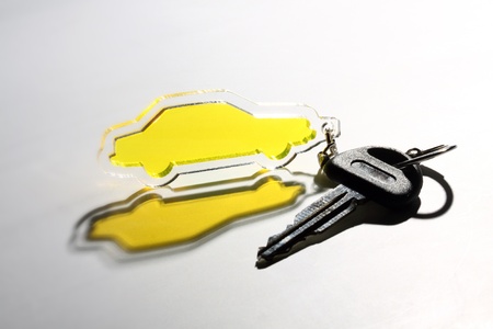 yellow transparent car keychain and keyの写真素材