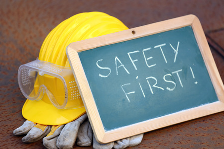 helmet, goggles, gloves and greenboard. safety first conceptの写真素材