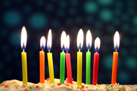 Nine lit birthday candles close up, shallow dofの写真素材