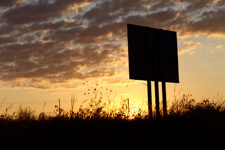 black empty signboard under sunrise skyの写真素材