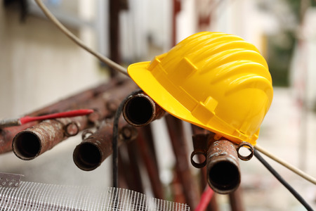 Yellow helmet on work place