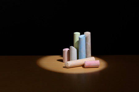 colored chalk for drawing on street close up in the spotlight.の写真素材